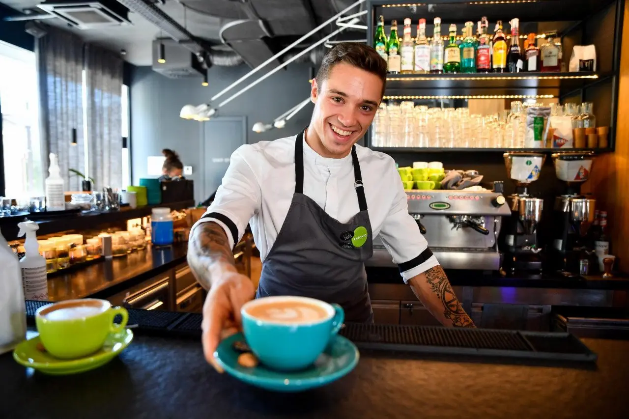 Friendly bartender serving